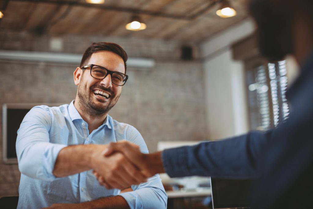 Entrepreneur shaking hands with representative of a large company.Concept: vendor agreement