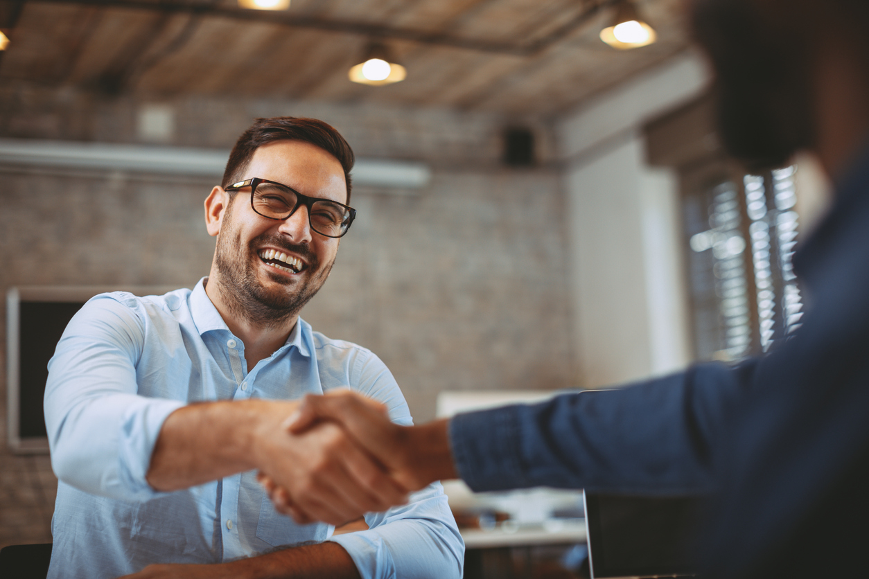 Entrepreneur shaking hands with representative of a large company.Concept: vendor agreement