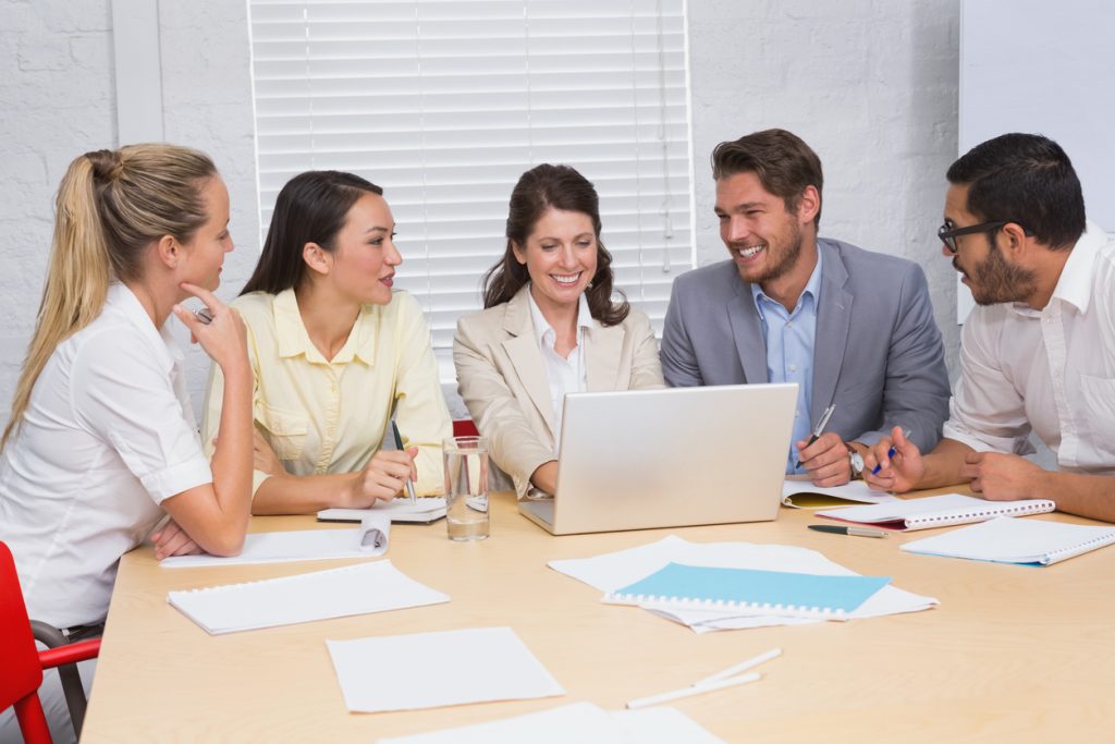 Business training with 5 people at a table. Concept: SBDC or Small Business Development Center