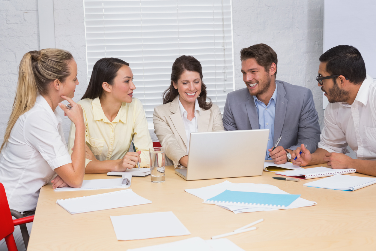 Business training with 5 people at a table. Concept: SBDC or Small Business Development Center
