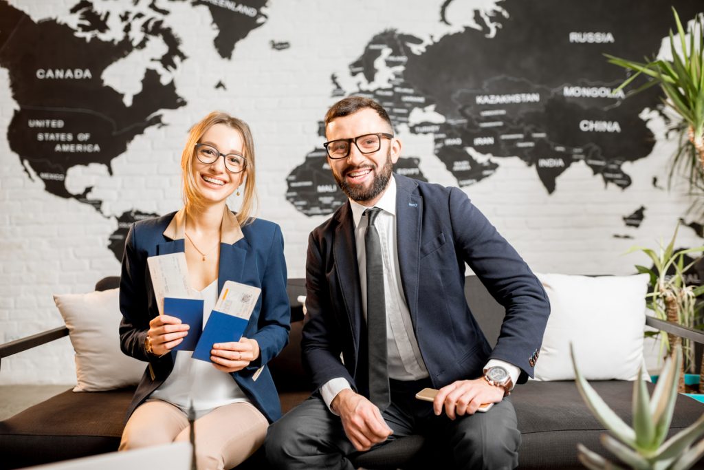 Couple with passports at travel agency. Concept: Online Travel Agent