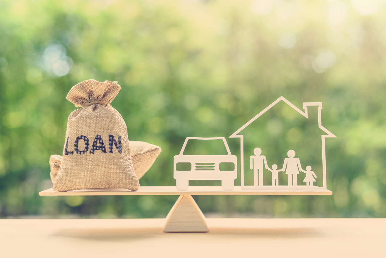 Loan bags, family in a house on balance scale, depicts secured vs unsecured business loans