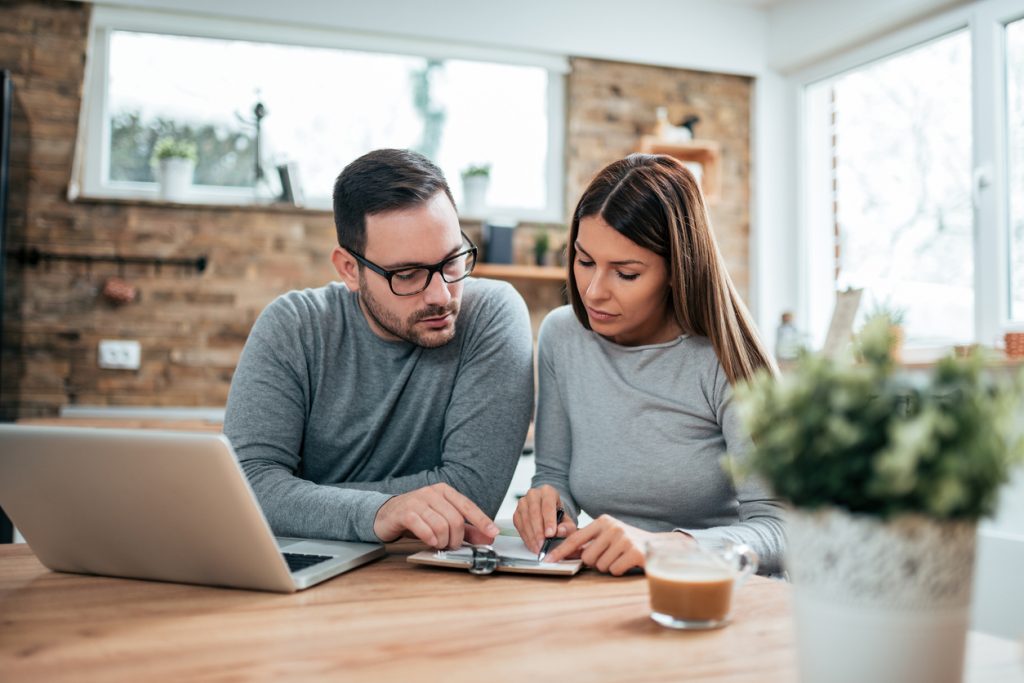 Couple filing taxes at home. Concept: Is social security taxable?