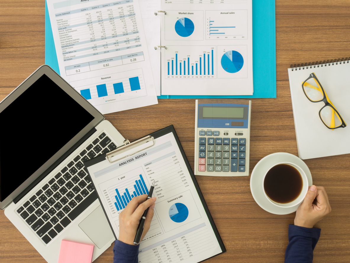 Financial analyst analyzing business data on desk. top view. Accounting concept. Concept: quarterly taxes