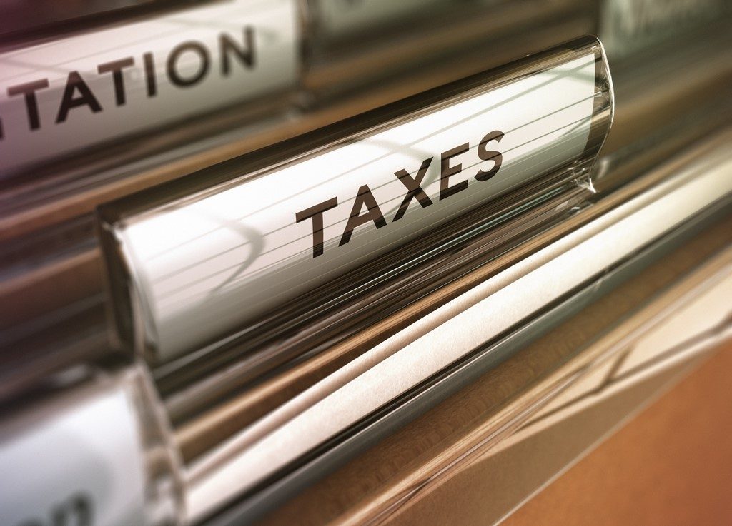 Tax folder with vintage style with blur effect. Concept for financial pupose. Concept: Quarterly taxes vs annual taxes