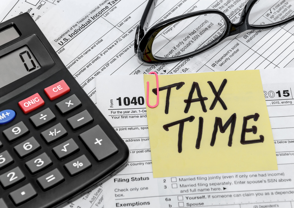 tax form with callculator and glasses. Concept: tax filing