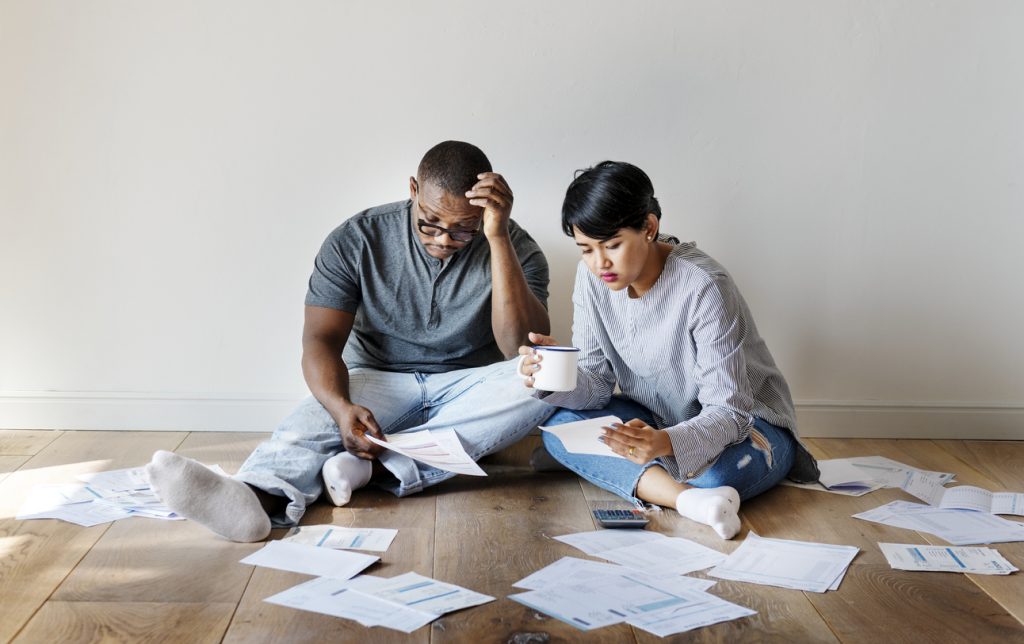 Couple managing the debt ***These documents are our own generic designs. They do not infringe on any copyrighted designs. Concept: debt settlement