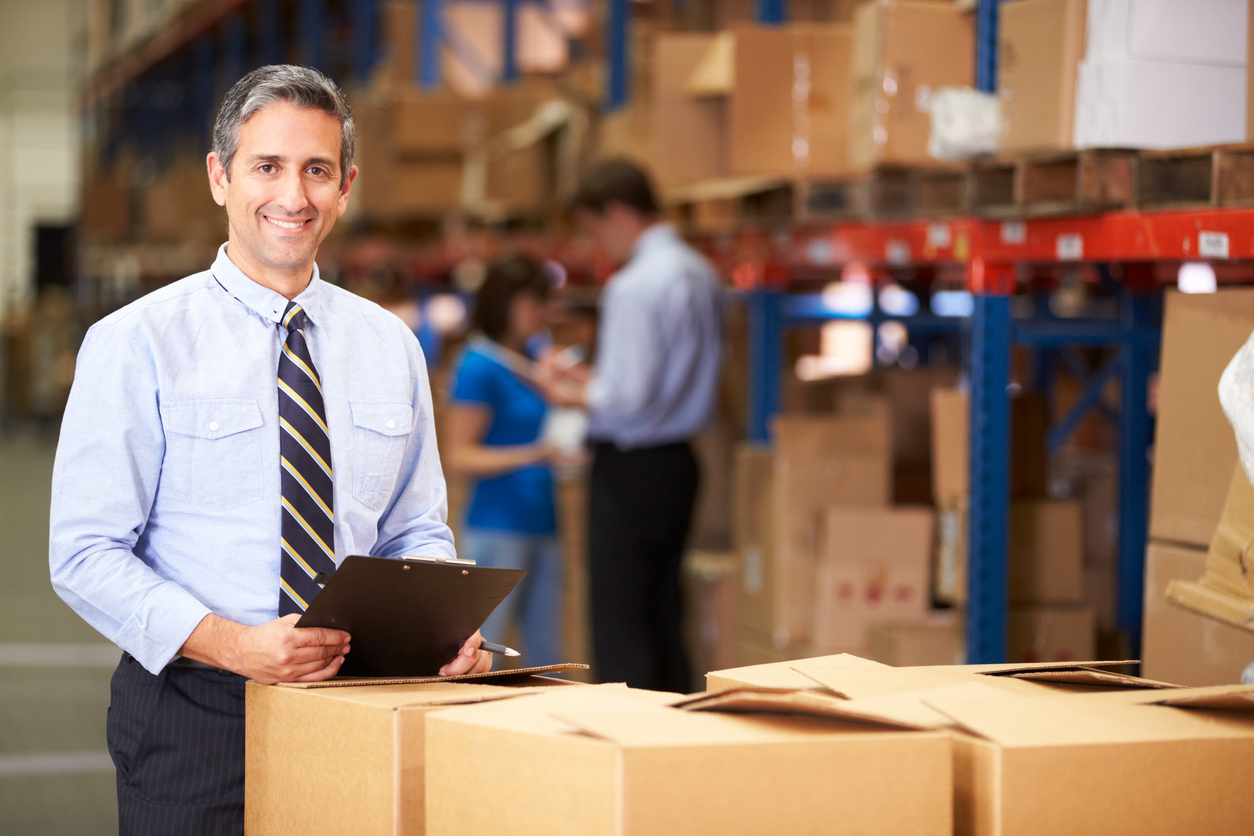 Manager In Warehouse Checking Boxes . Concept: fixed expenses