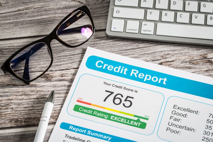 Close up of credit report on desk. Concept: How long do hard inquiries stay on your credit report?