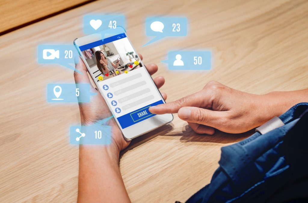 woman share view of beauty blogger review online with mobile apps on wood table at home,online influencer technology in daily lifestyle,Digital age. concept: facebook stories