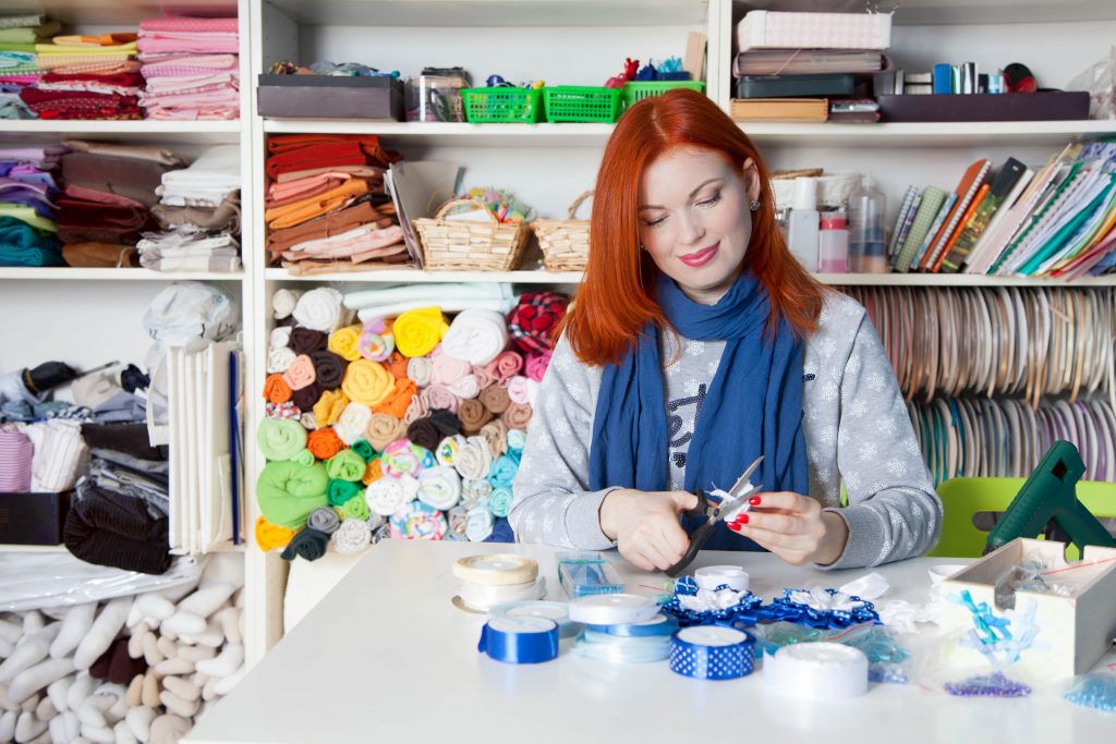Woman working on hand-made crafts. Concept: How to start an Etsy shop