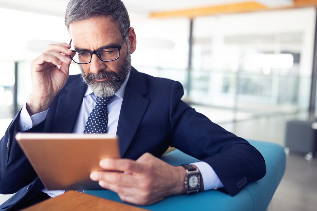 Banker studying ChexSystems report.
