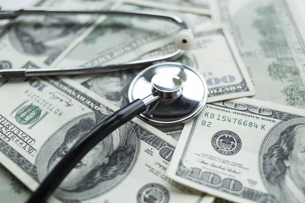 Medical costs. Stethoscope on the dollars. concept: medical loans