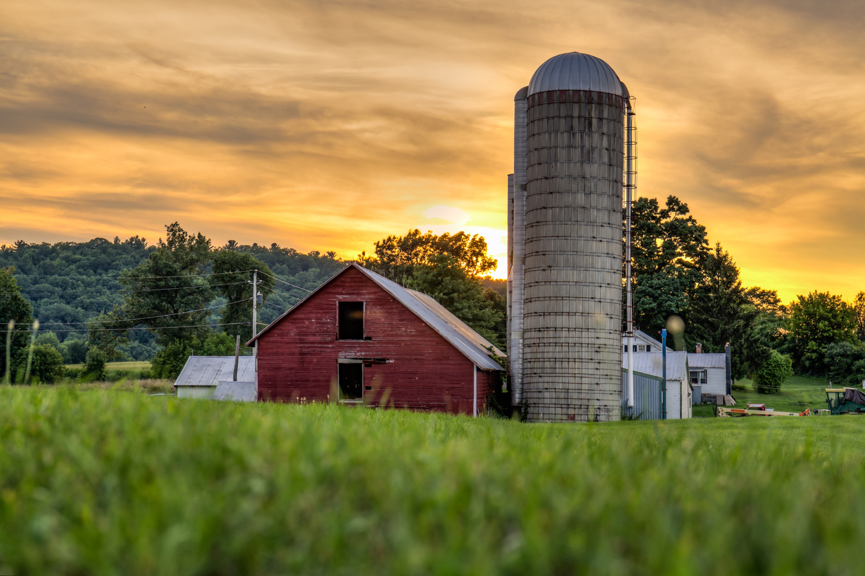 The barn during a moody sunset in the Berkshire Mountains. concept: farm financing
