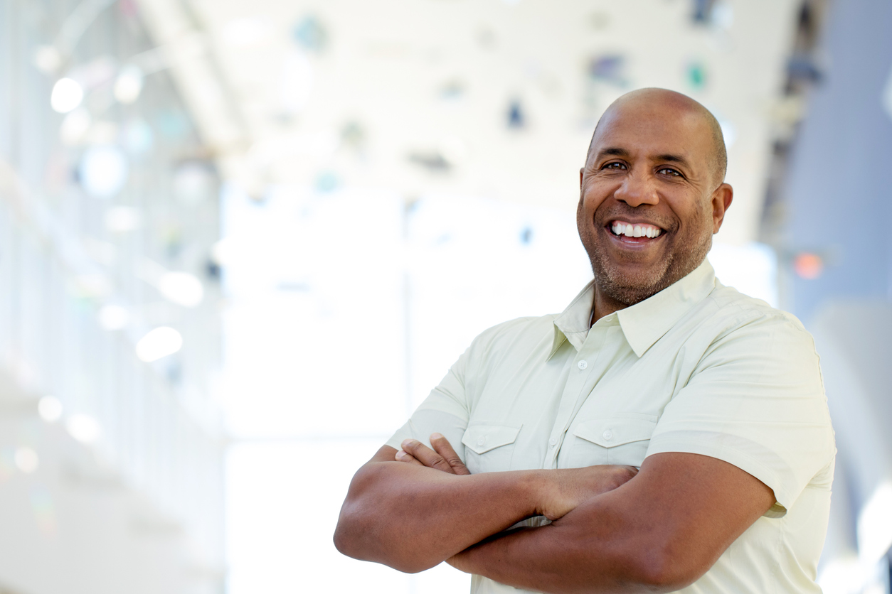 Mature African American smiling and looking at the camera. concept: certificate of good standing